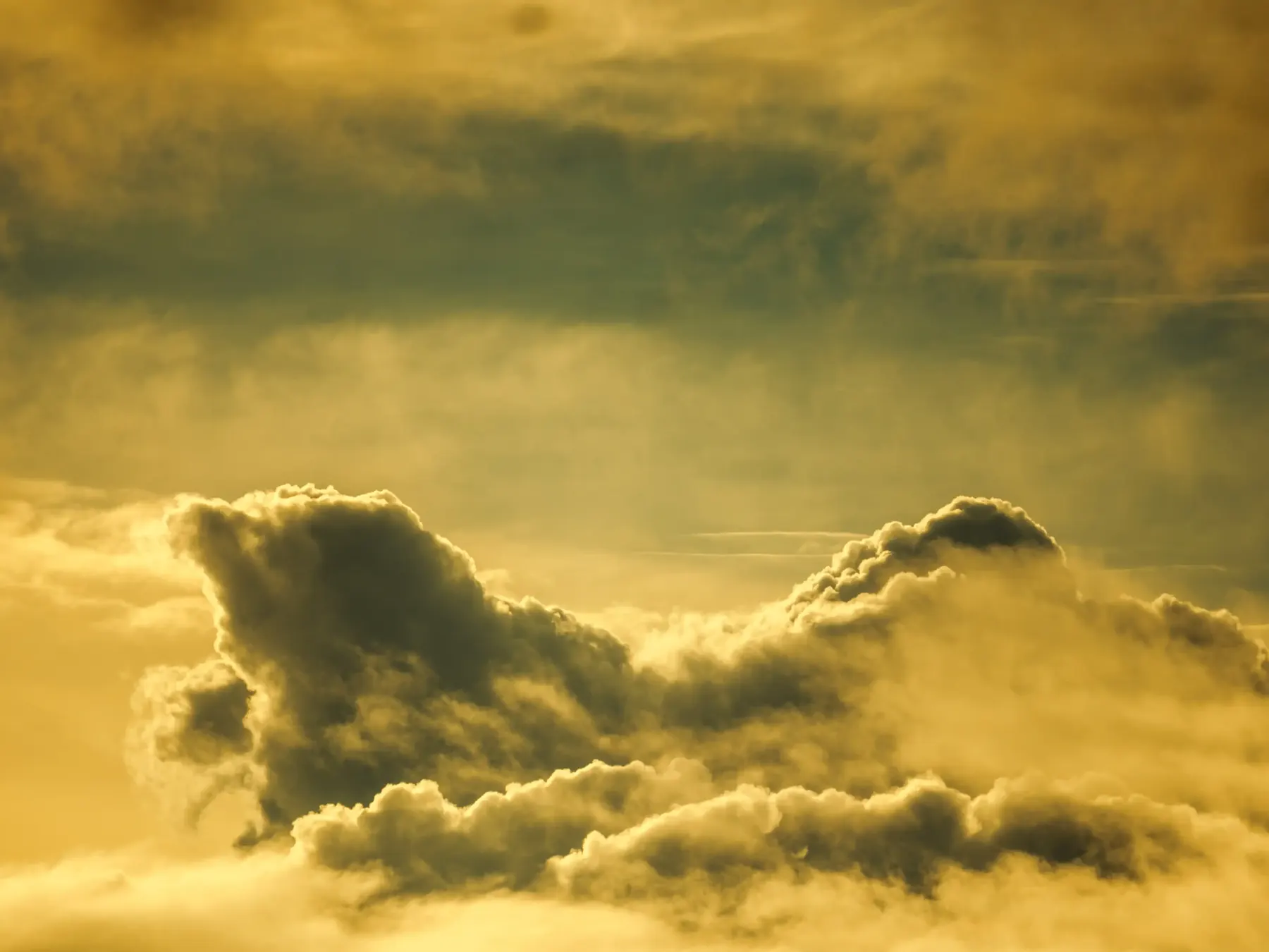 Layered golden clouds lit by low sun