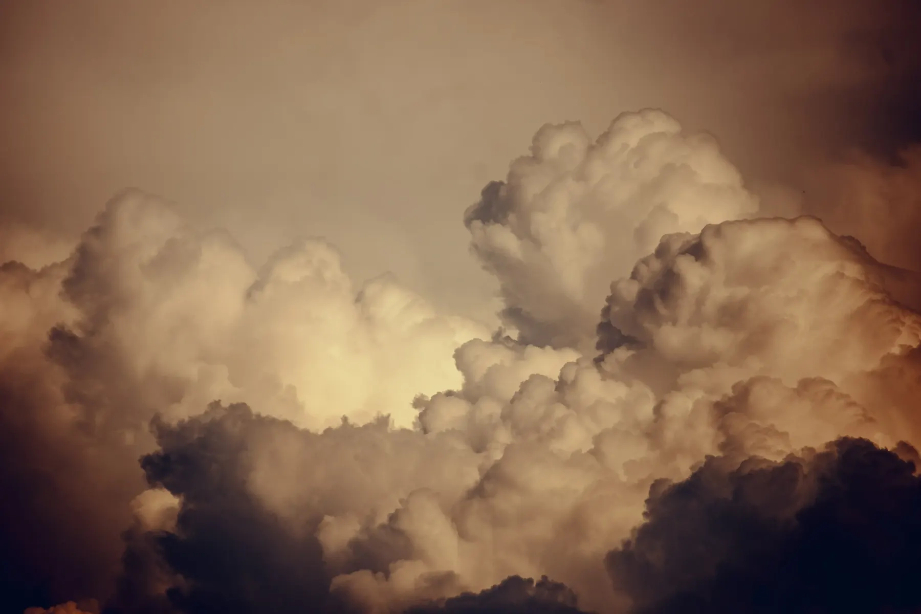 A warm-toned cloud formation in soft light