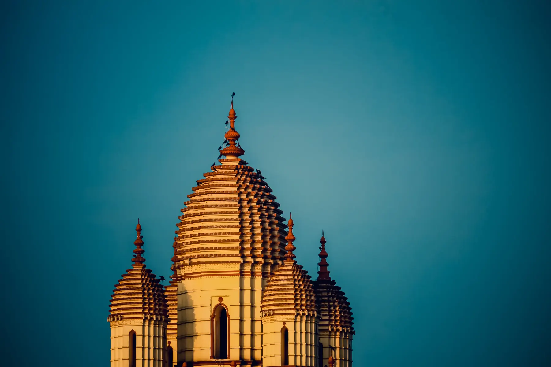 A domed temple lit by golden hour light