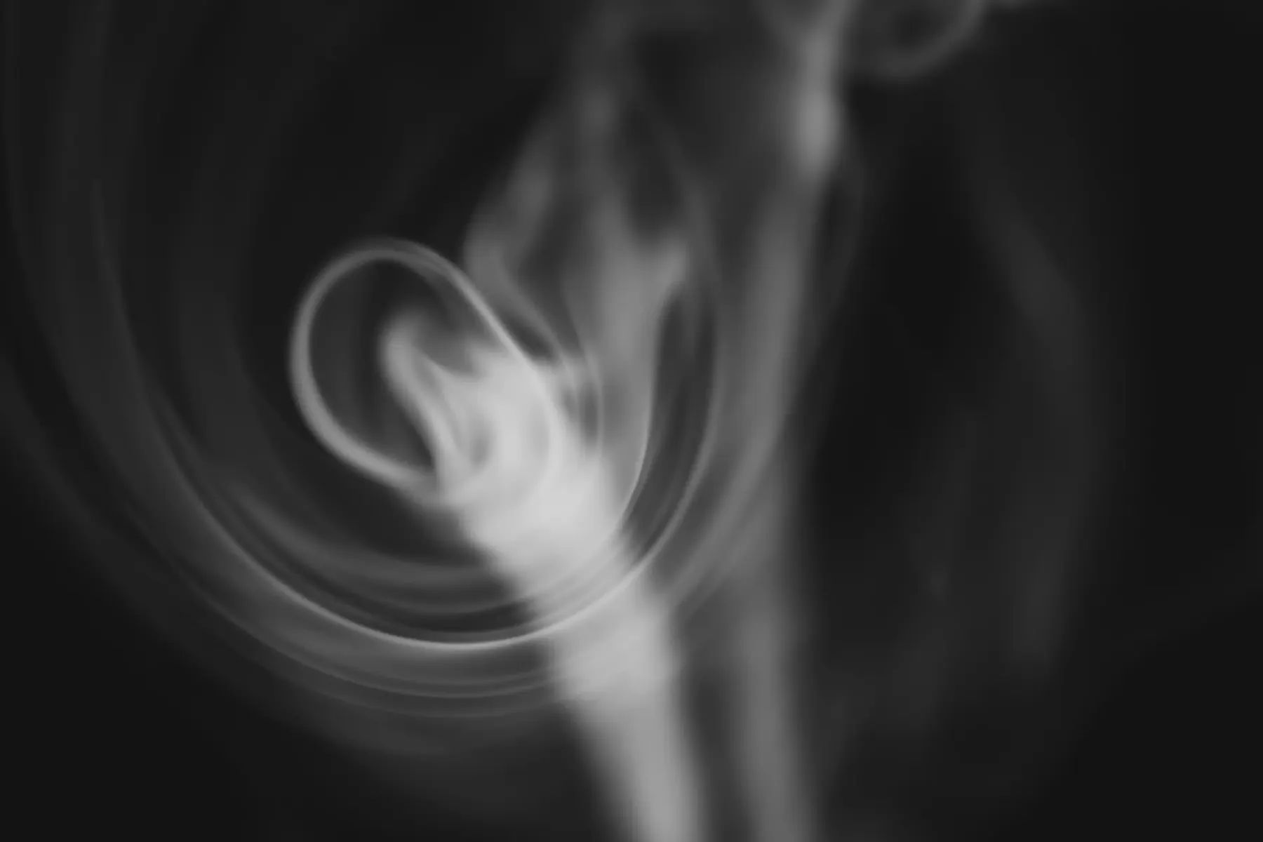 Abstract swirling smoke forming a circular shape