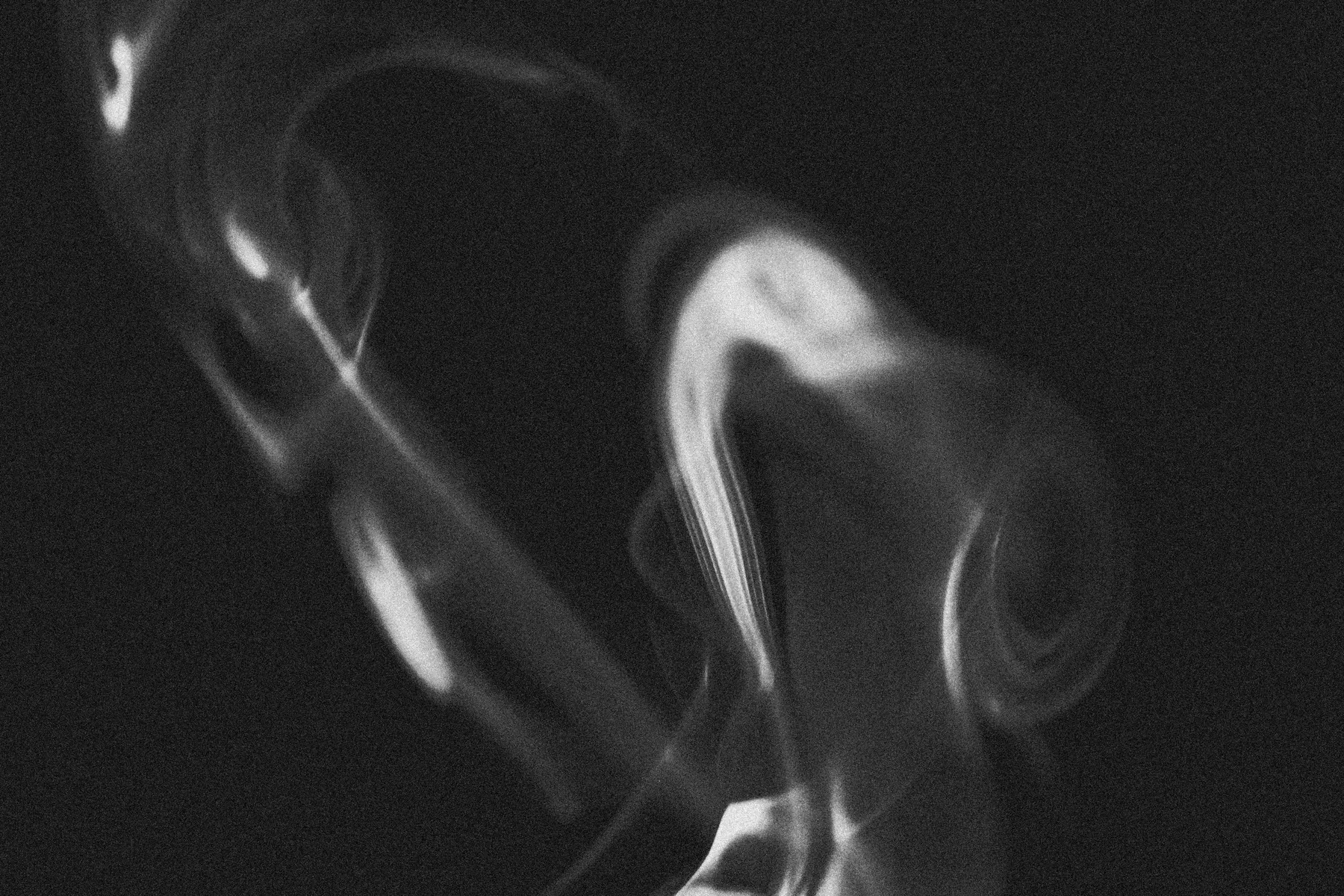 Abstract looping curls of smoke