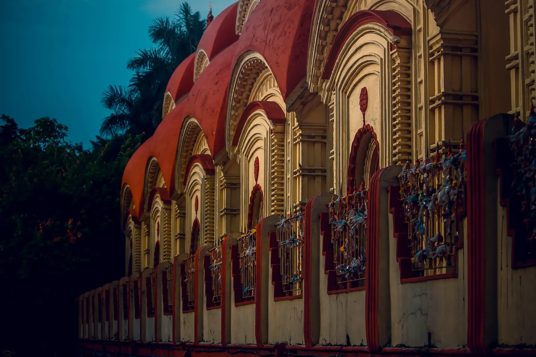 A temple facade with an arched colonnade